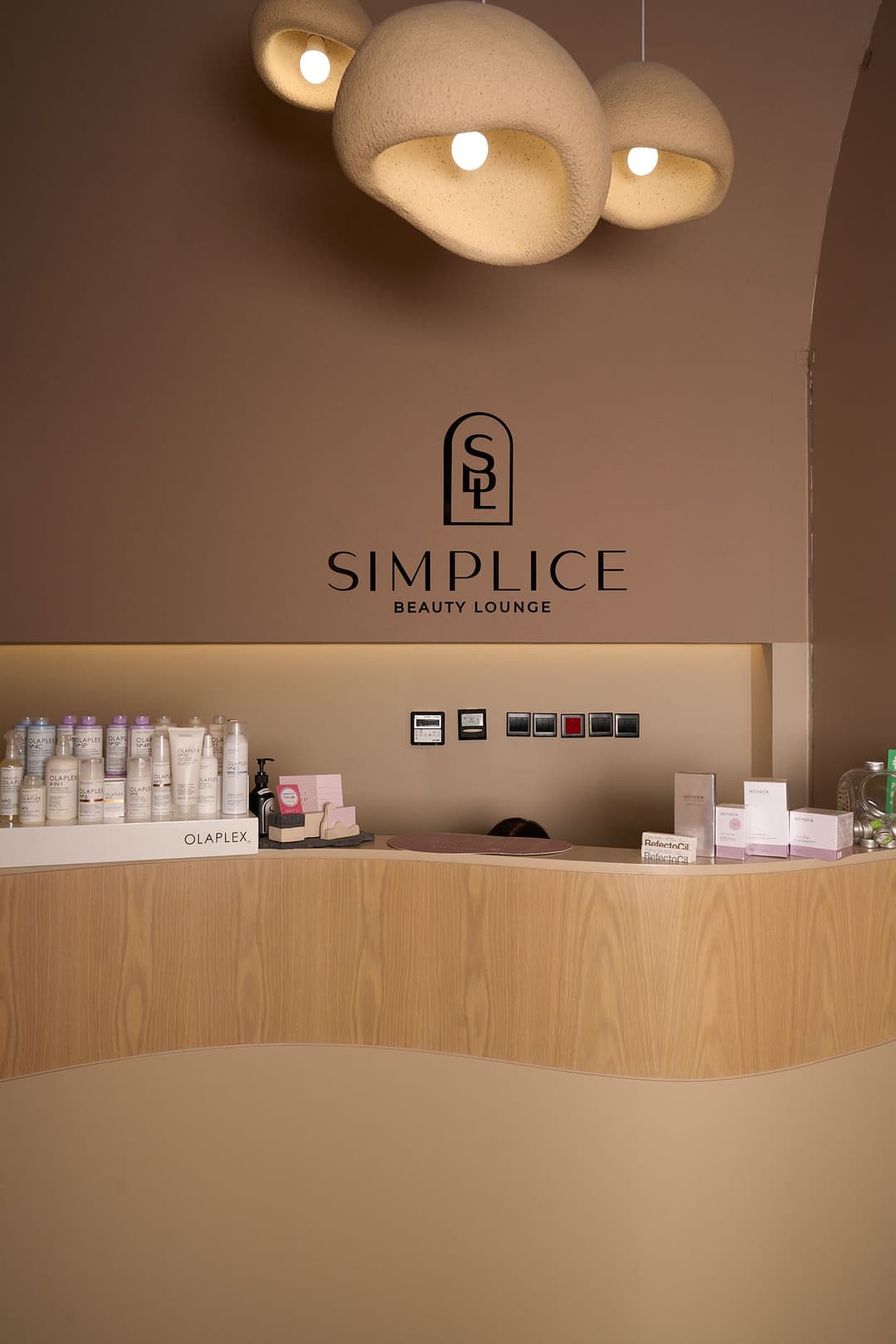 Reception lamps and the Simplice logo